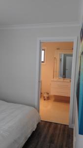 Postel nebo postele na pokoji v ubytování Dreamcatcher@Bicheno