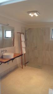a bathroom with a sink and a shower at Dreamcatcher@Bicheno in Bicheno