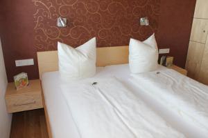 Postel nebo postele na pokoji v ubytování Appartements Aurora