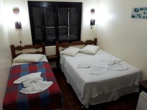 Een bed of bedden in een kamer bij Hotel Guarita