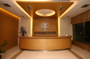 a waiting room with a counter in a building at Hotel Flisvos in Kalamata