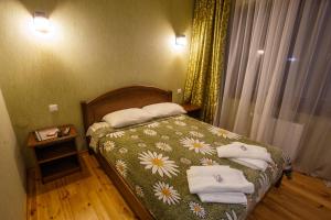 Postel nebo postele na pokoji v ubytování Bilovoddya Hotel