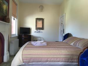 Giường trong phòng chung tại Hamlyn House Bed and Breakfast