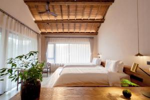 Postel nebo postele na pokoji v ubytování Leaf One Mogan