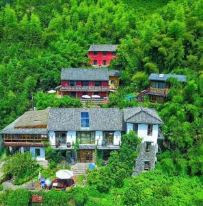 an aerial view of a house on a hill at Mogan Mountain Xiaomusensen in Deqing