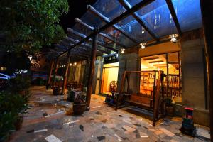 a store front with a building with glass windows at T&T Story Hotel (Xi Gong Pier) in Kunming