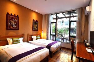 Giường trong phòng chung tại T&T Story Hotel (Xi Gong Pier)