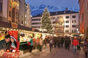 a crowd of people walking through a christmas market at Haidegger Appartements in Innsbruck