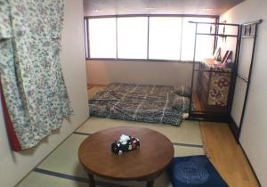 Postel nebo postele na pokoji v ubytování Tsukiji Hostel Wakayama 1