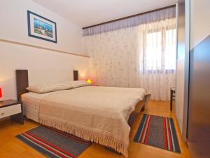 Postel nebo postele na pokoji v ubytování Apartments Blazenka 1270