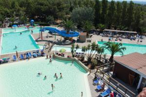 an overhead view of a swimming pool at a resort at Camping Village Baia del Marinaio in Vada