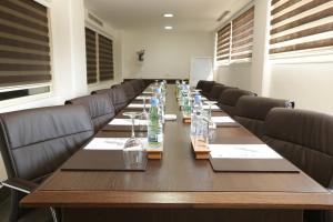 a conference room with a long table and chairs at Golden Lili Resort & Spa in Aley +63 photos