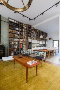 a living room with a table and a dining room at Veeve - Saint-Lambert Deluxe in Paris