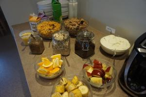 a kitchen counter filled with lots of different types of food at Skútustadir Guesthouse in Myvatn