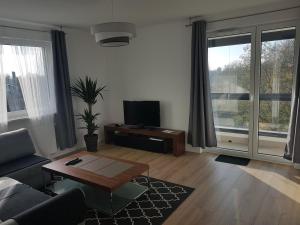 TV i/ili multimedijalni sistem u objektu Hennela Apartment