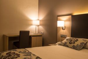 Postel nebo postele na pokoji v ubytování Hotel Valentin