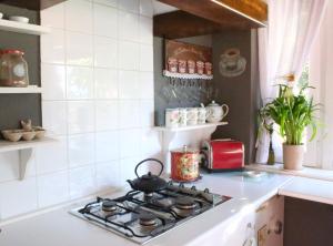 Kuchyňa alebo kuchynka v ubytovaní Casa Rosa Garden House