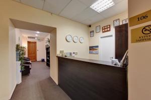 an office with a reception counter and a waiting room at Sfera hotel Nevsky 163 in Saint Petersburg