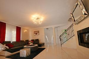 a living room with a couch and a fireplace at Villa Zare in Poreč