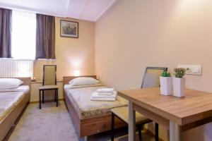 Voodi või voodid majutusasutuse Hotel Reverence toas