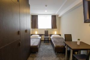 Voodi või voodid majutusasutuse Hotel Reverence toas
