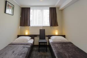 Postel nebo postele na pokoji v ubytování Hotel Reverence
