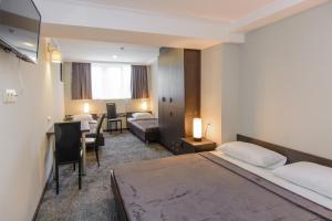 Voodi või voodid majutusasutuse Hotel Reverence toas