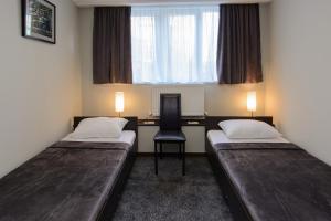 Voodi või voodid majutusasutuse Hotel Reverence toas