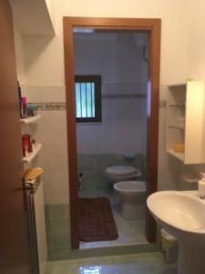 a bathroom with a toilet and a sink at Villa Rea Bed&Beauty in Castelfidardo