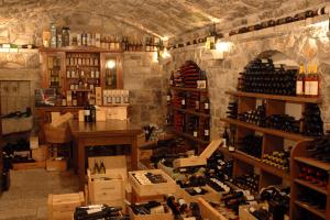 a room filled with lots of bottles of wine at Lokanda Devetak in Savogna dʼIsonzo