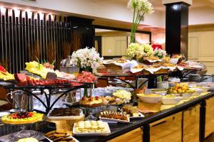 a buffet filled with lots of different types of food at Pestana Buenos Aires in Buenos Aires