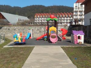 a playground with different types of play equipment at Cottage Sunny Side in Bakuriani