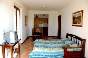 Postel nebo postele na pokoji v ubytování Casale il Colle Deruta + 37 fotografií