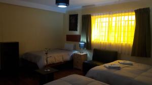 Postel nebo postele na pokoji v ubytování Kurumi Hostel