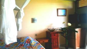 Rúm í herbergi á Studios Carribean Sea View