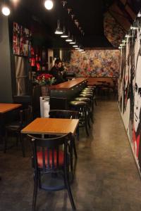 a row of tables and chairs in a restaurant at West House Residence in Beirut