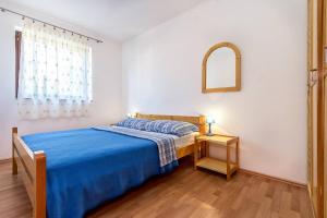 Posteľ alebo postele v izbe v ubytovaní Apartment Lenka