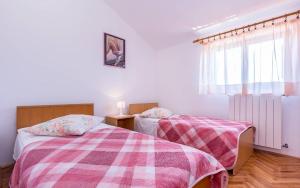 Postel nebo postele na pokoji v ubytování Apartments Winny