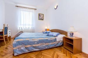 Postel nebo postele na pokoji v ubytování Apartments Winny