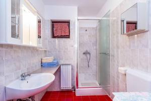 Koupelna v ubytování Apartments Winny