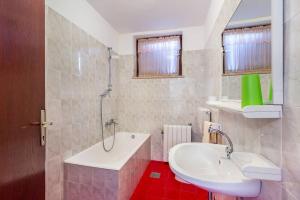 Koupelna v ubytování Apartments Winny