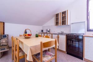 Kuchyň nebo kuchyňský kout v ubytování Apartments Winny