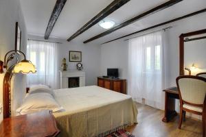 Łóżko lub łóżka w pokoju w obiekcie Villa Lucy