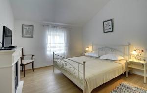 Łóżko lub łóżka w pokoju w obiekcie Villa Lucy