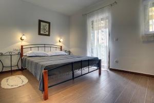 Łóżko lub łóżka w pokoju w obiekcie Villa Lucy