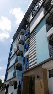 an exterior view of a building at PA House Apartment in Bangkok