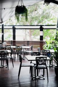 a group of tables and chairs in a restaurant at General Roberts Hotel in New Lambton