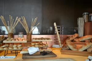 a table topped with lots of different types of bread at The Torch Doha in Doha
