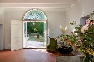 an open door to a living room with a glass window at La Milzetta in Russi