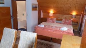 Postel nebo postele na pokoji v ubytování Apartman U Hanicky